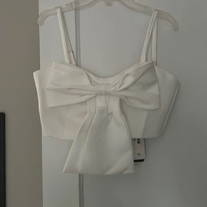 Size small brand new with tags white bow crop top!! Never worn
